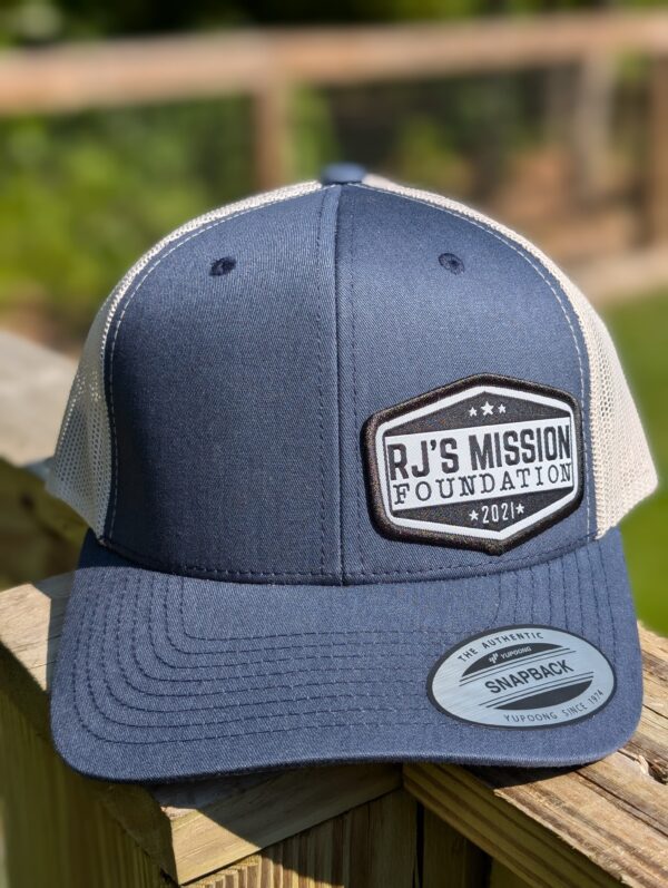 RJ’s Mission Emblem Trucker Hat