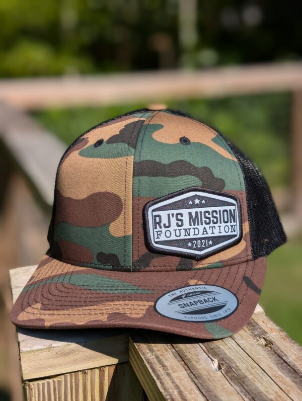 RJ’s Mission Emblem Trucker Hat - Image 2